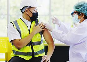 construction worker getting vaccinated